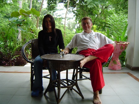 Bill and his wife Rung lounging on their porch at their home in Thailand